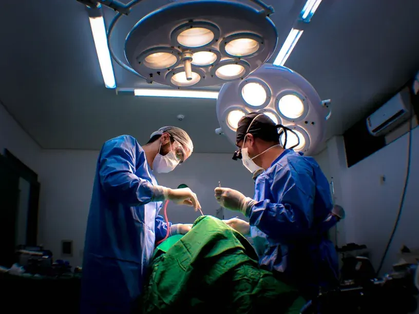 Surgical team performing a procedure in an operating room